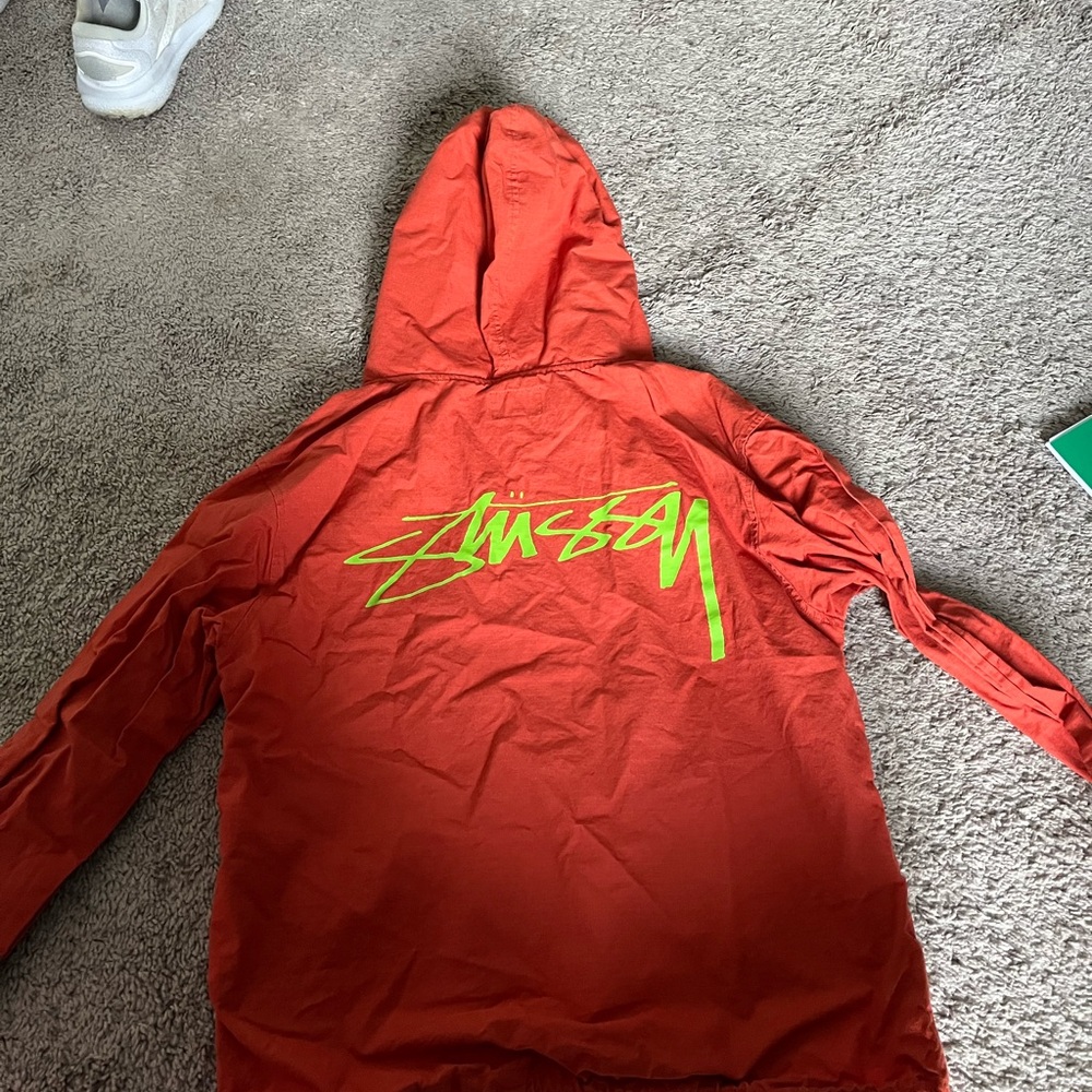 Stussy Orange pullover with neon green/yellow Logo on back